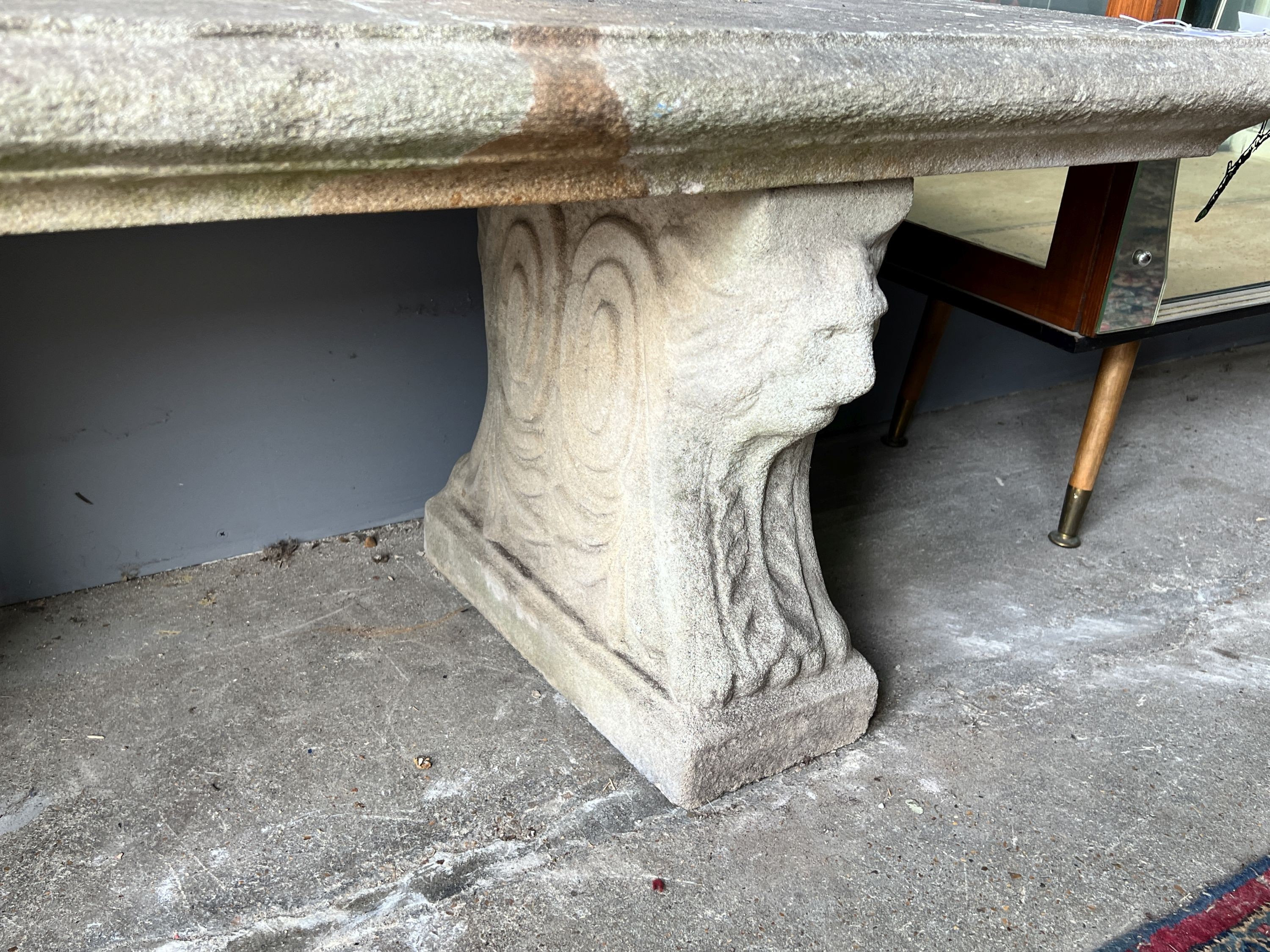 A rectangular reconstituted stone garden bench, length 126cm, depth 40cm, height 44cm